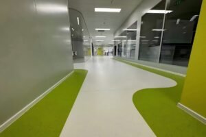 Multi-layer commercial PVC flooring installed in a corridor project