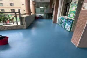 Multi-layer commercial PVC flooring installed in a school corridor project